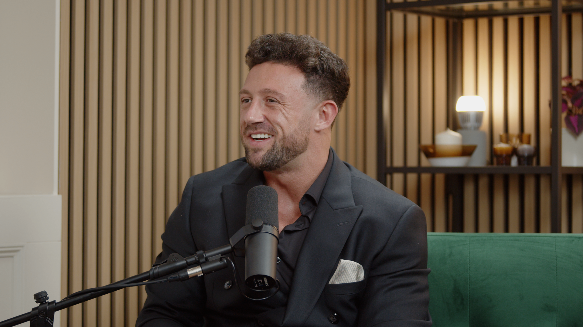 Still frame of a guest in a suit mid-interview